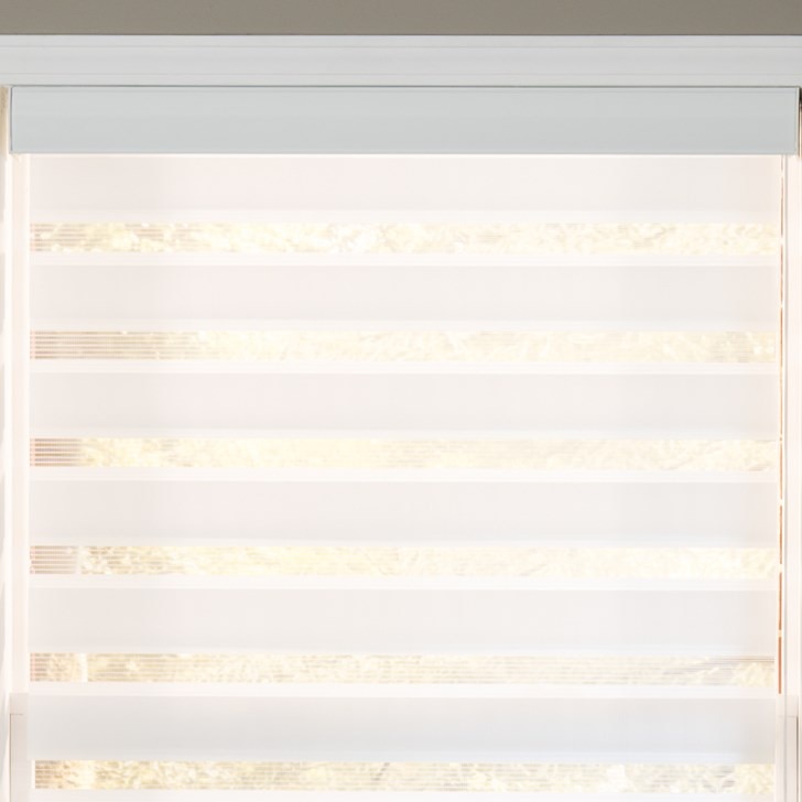 Light filtering dual sheer shade in the deluxe color option Veranda Glacier