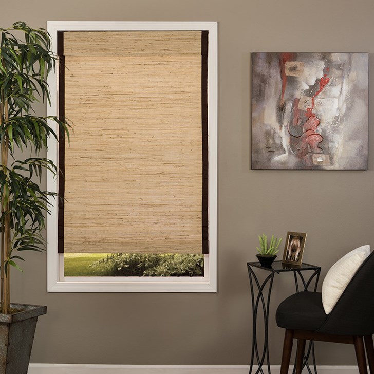 Deluxe woven wood shade in the color option Natural Weave Bleached with edge binding in Black
